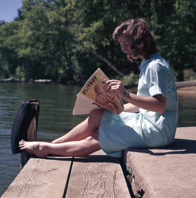 Reading of woman sitting in the lake
